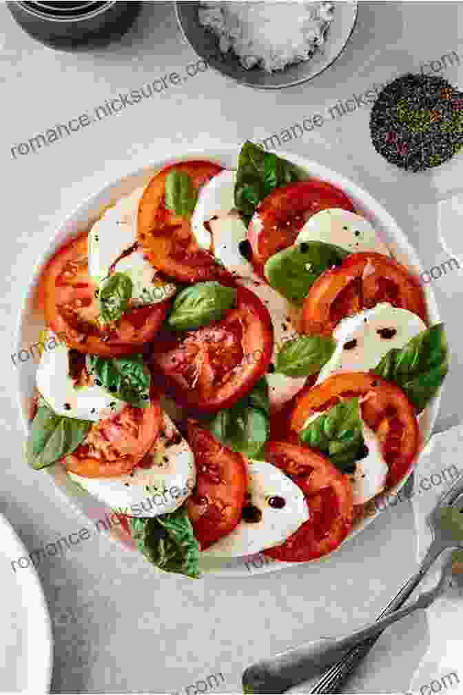 A Classic Italian Caprese Salad, Featuring Ripe Tomatoes, Fresh Mozzarella, And Basil, Drizzled With A Delicate Olive Oil Dressing THE OF SALADS FROM DIFFERENT COUNTRIES