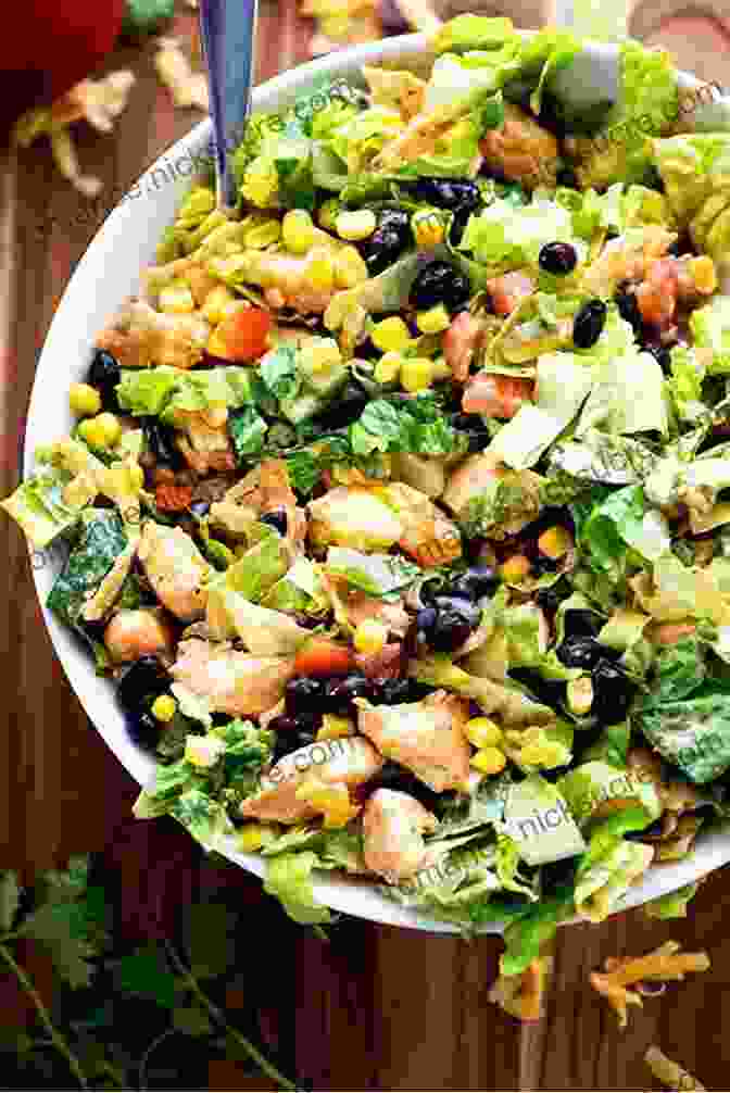 A Colorful Mexican Ensalada, Featuring Grilled Chicken, Black Beans, Corn, Tomatoes, And Lettuce, Drizzled With A Tangy Lime Vinaigrette THE OF SALADS FROM DIFFERENT COUNTRIES