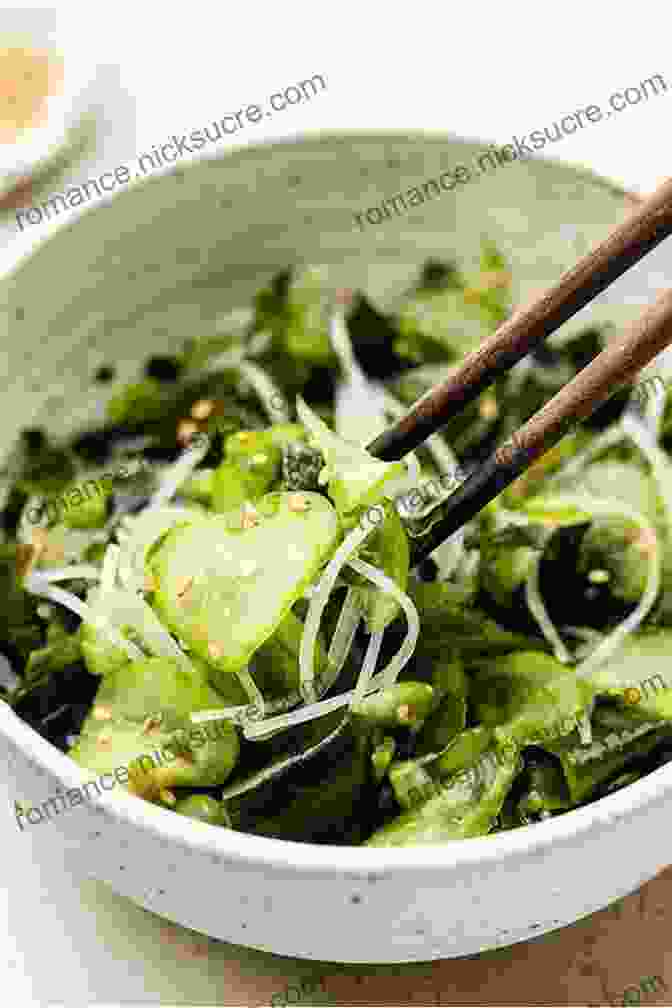 A Delicate Japanese Sunomono Salad, Featuring Shredded Cucumbers, Carrots, And Wakame Seaweed, Tossed In A Tangy Rice Vinegar Dressing THE OF SALADS FROM DIFFERENT COUNTRIES