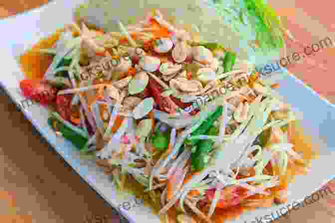 A Tantalizing Plate Of Thai Som Tum, Featuring Shredded Green Papaya, Tomatoes, Peanuts, And Chili Peppers, Tossed In A Spicy Lime Dressing THE OF SALADS FROM DIFFERENT COUNTRIES